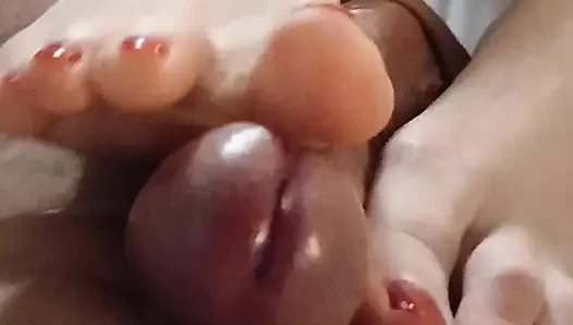 Kelly performs a technical footjob bringing Dominik's cock to a squirting orgasm.