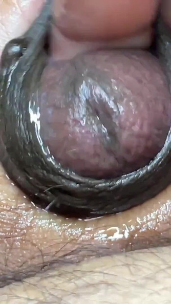 Iconic moment from "Guy masturbating by rubbing the head of the dick and fingering it like a pussy"
