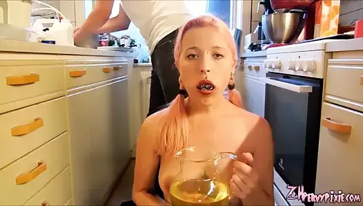 Beauty drinks urine from a jug