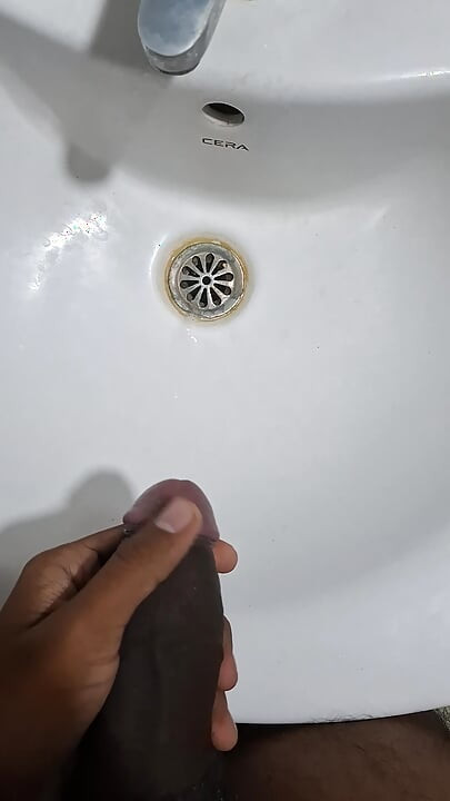 Peeing while jerking in bathroom