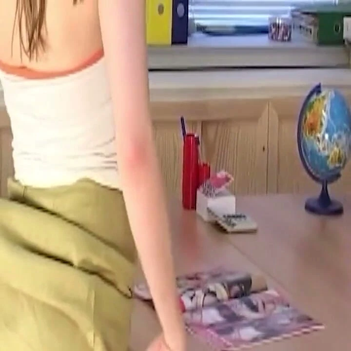 Brunette Strips Naked and Poses on Desk