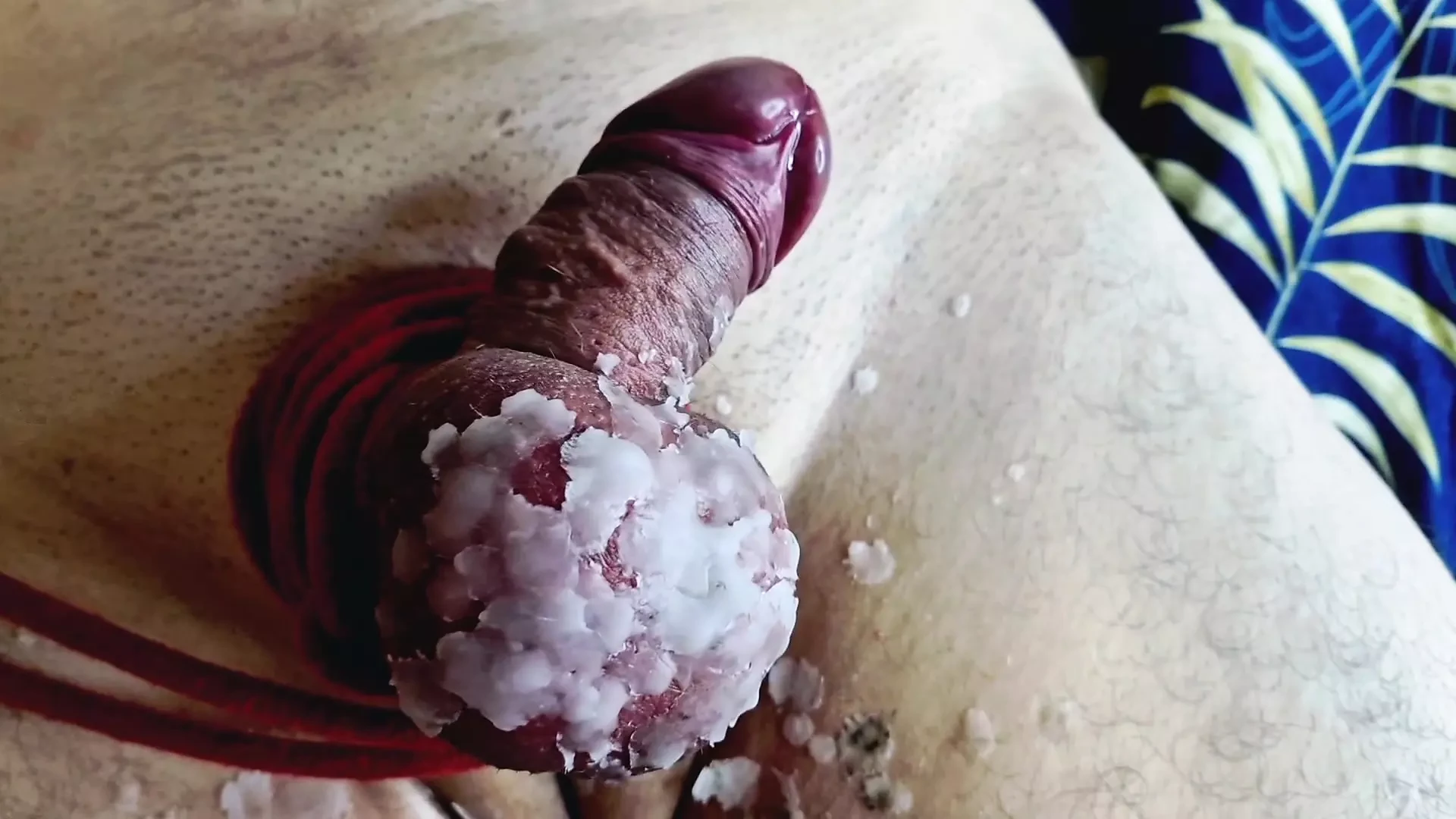 Dominatrix Nika ties her slave’s balls tightly with rope and pours hot candle wax on his cock and balls. CBT
