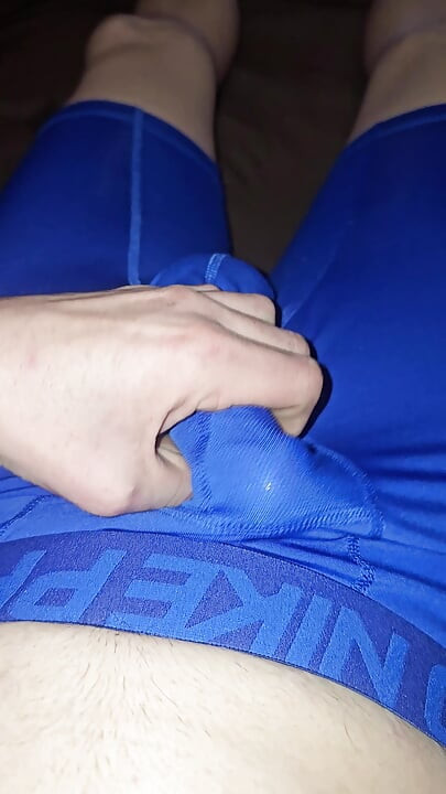 I wank and cum inside a condom while I wear my Blue Nike pro spandex underwear