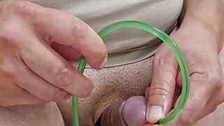Cock stretching with 14mm ball sound and piss drained through silicone hose in peehole