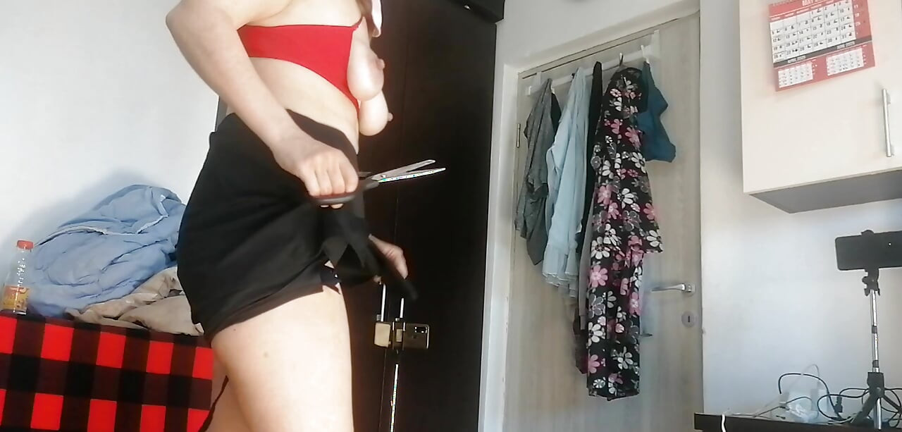Amateur Wife Dancing Naked at Home. Amateur Woman Has Fun Trying on Clothes and Cutting Them.