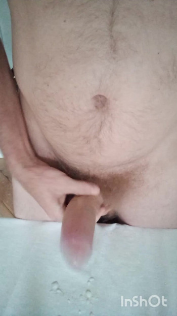 Mature man with uncut hairy penis cums after masturbating