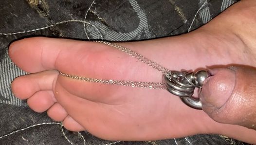 Compilation of a few videos of my cock chained to my feet, masturbating with my feet and showing my pierced cock