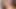 One white girl is trying to suck two black cocks at the same time