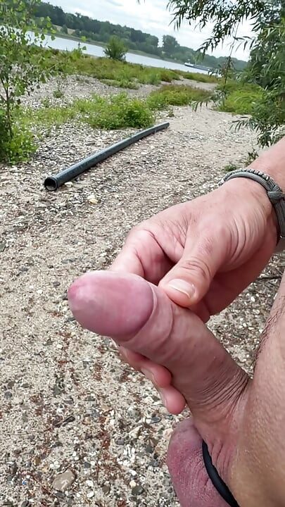 Jerk off and big load by the river