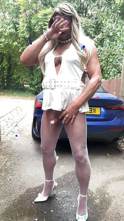 Sexy Crossdresser kellycd2022 in sexy white mini dress and fishnet pantyhose and heels