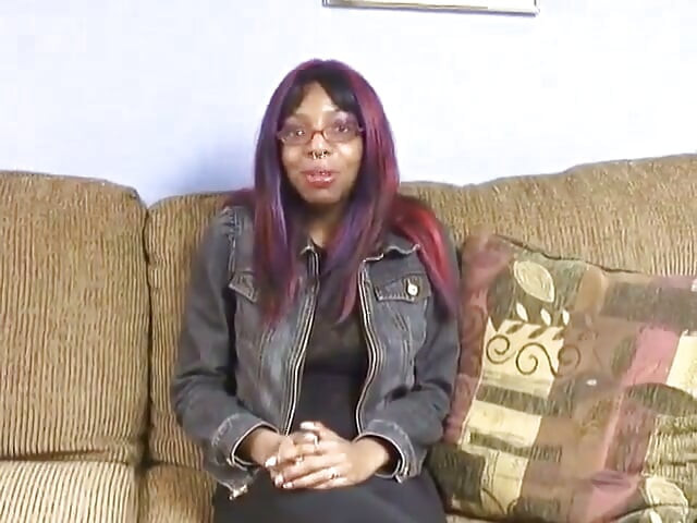 Black Chick with Nipple Rings on Her Big Tits Spreads Her Legs on the Couch