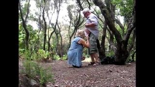 Naked senior couple in forest