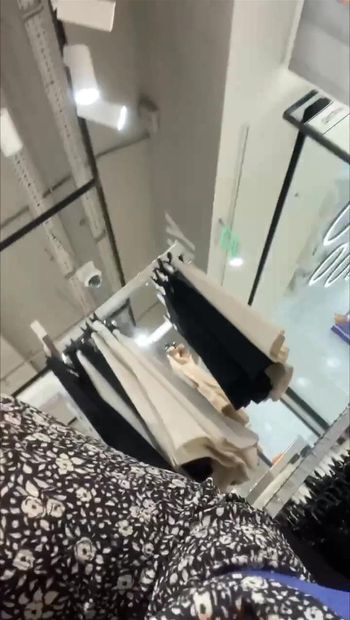 In a store in a dress and without panties