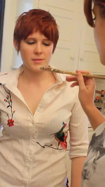 Unforgettable moment from "Short haired babe licks randy redhead's pussy in the kitchen"