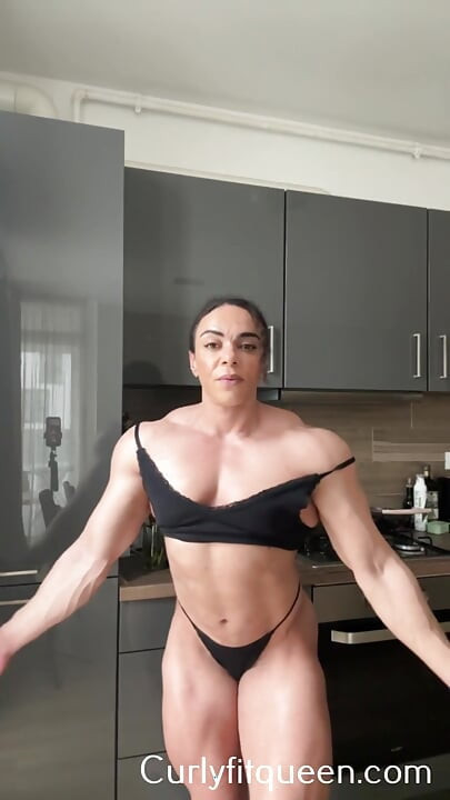 Ebony mom wears dominance like armor over muscular hips