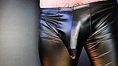 Cock bulge throbs in tight leather pants