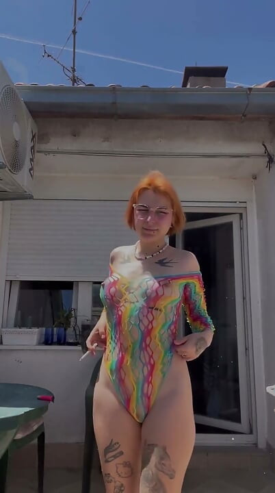 Smoking in a Rainbow Fishnet on the Balcony