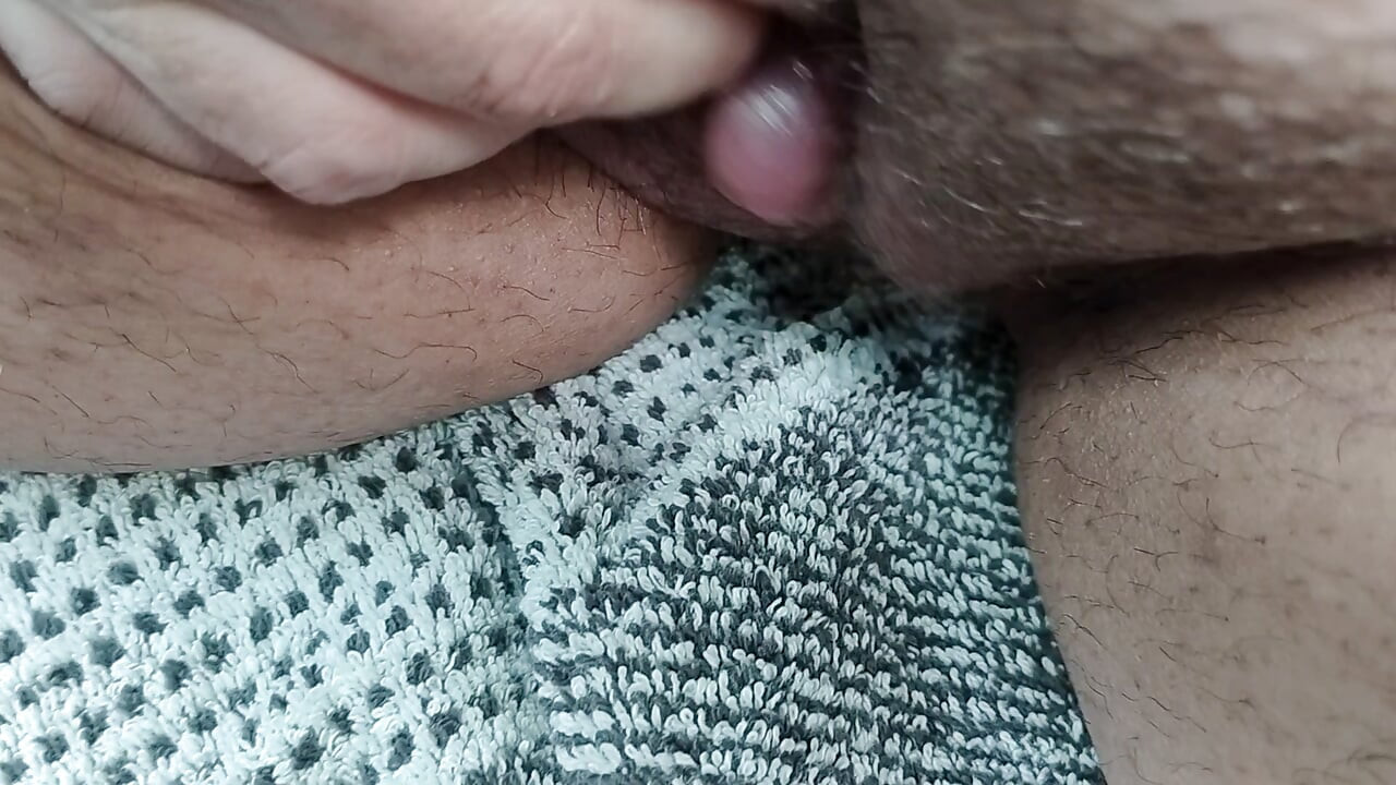I jerk off my little hard on in the car in a parking lot to climax