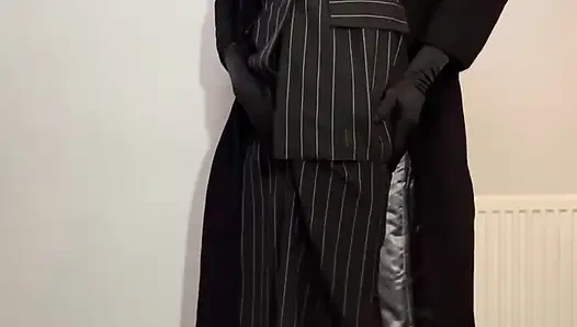 Crossdressing sissy dressed in her new skirt suit and long coat