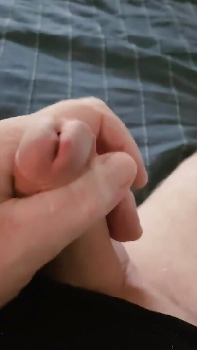 I lay and caress my cock and jerk off it longs