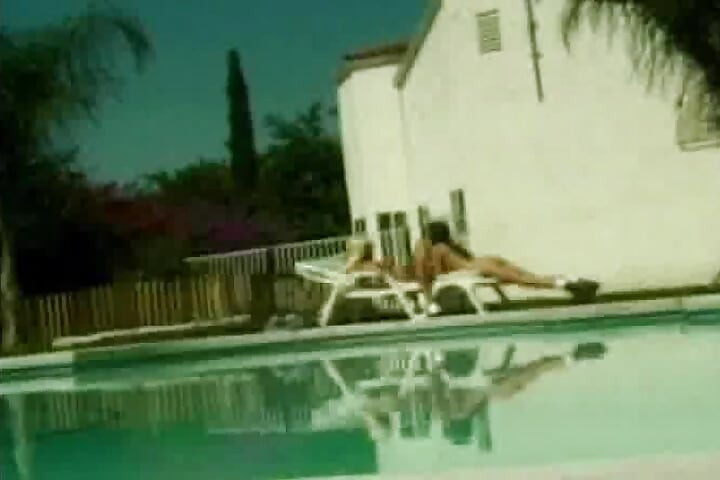 Tempting babes sharing big dildo poolside