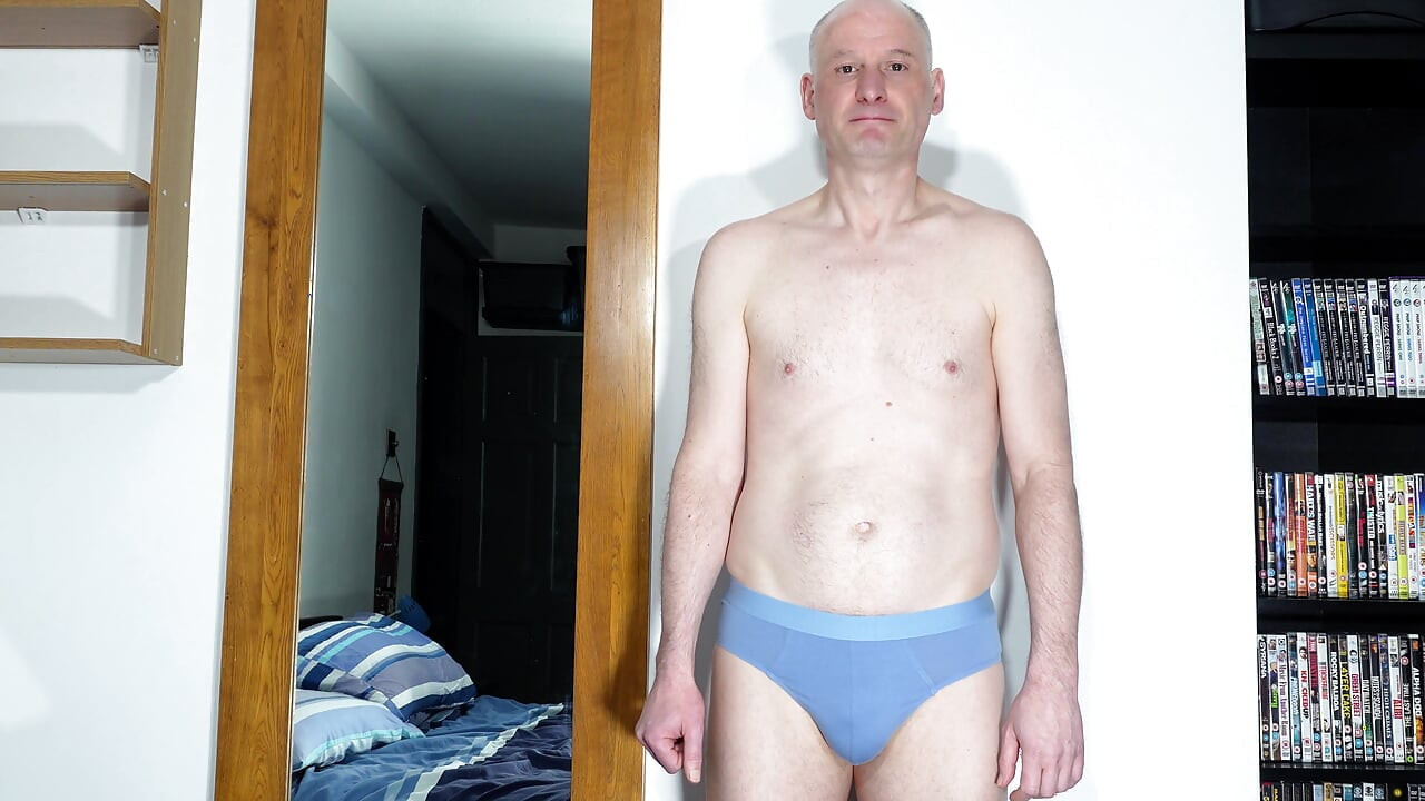 Zoom in close up as man takes off underwear and wanks his uncut cock from soft to throbbing erection