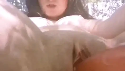 Masturbating with my pink dildo in the outdoors