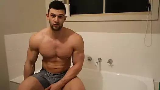 Muscle bodybuilder takes a bath and worships his soapy body