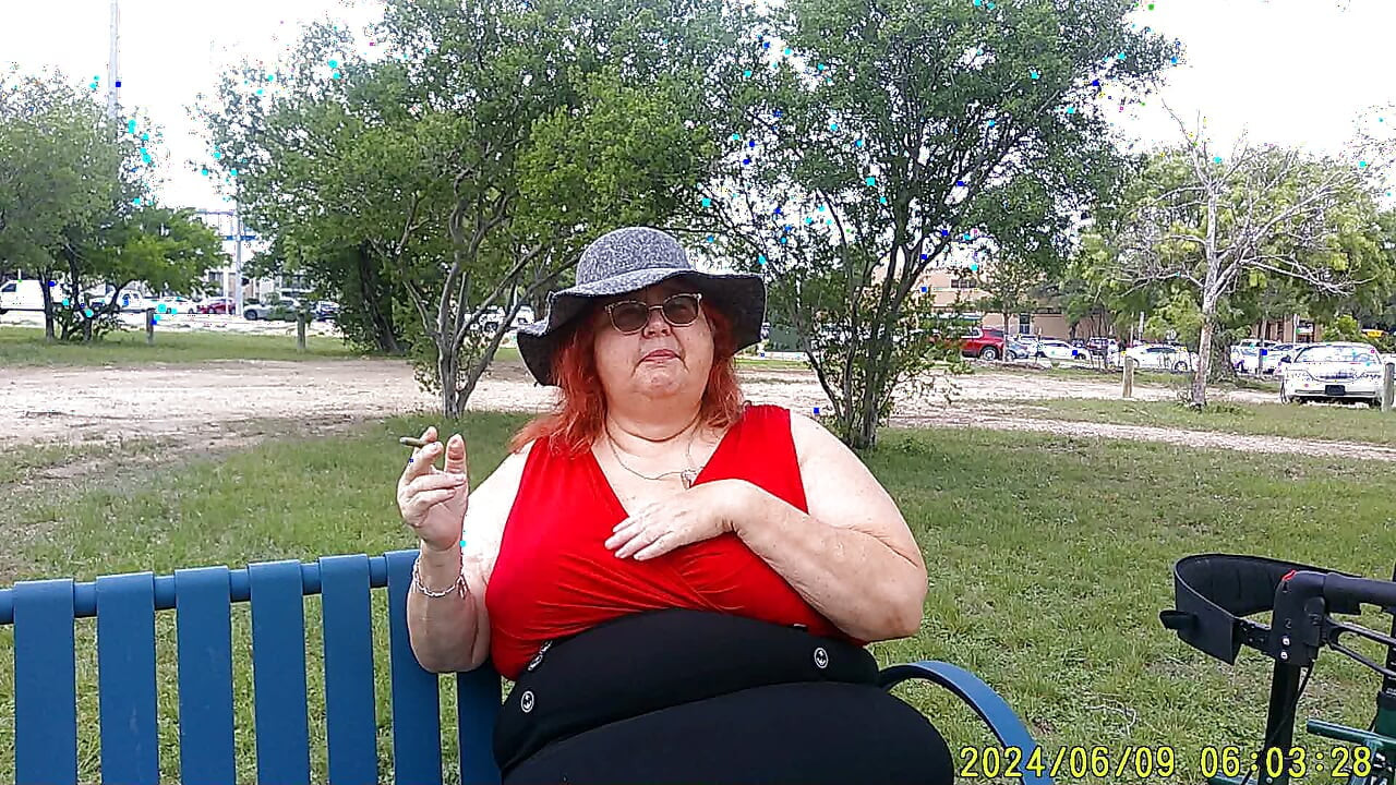 Nurse Vicki Smoking in the Park on a Bench All Dressed up