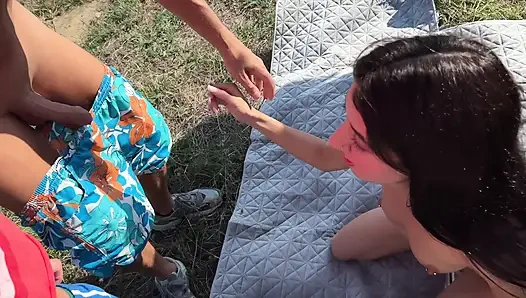 Three guys fuck a slutty pussy on the edge of a mountain - her mouth and pussy are occupied by cocks at the same time