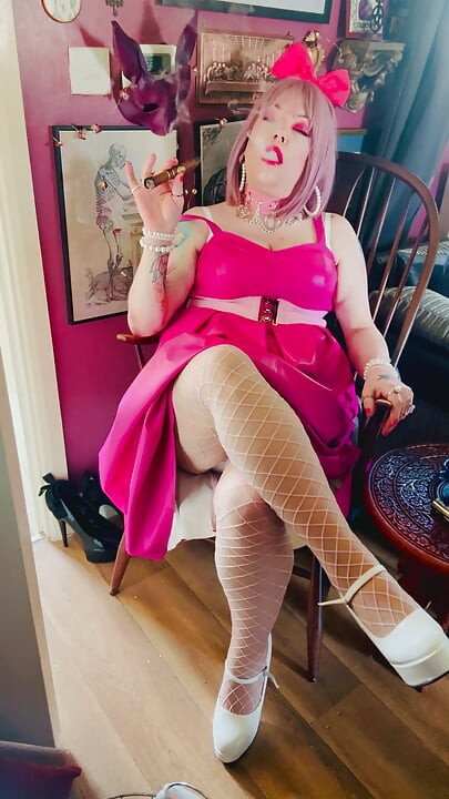 Pink To Make The Boys Wink! Tina Snua In A Leather Dress Smoking A Cigar