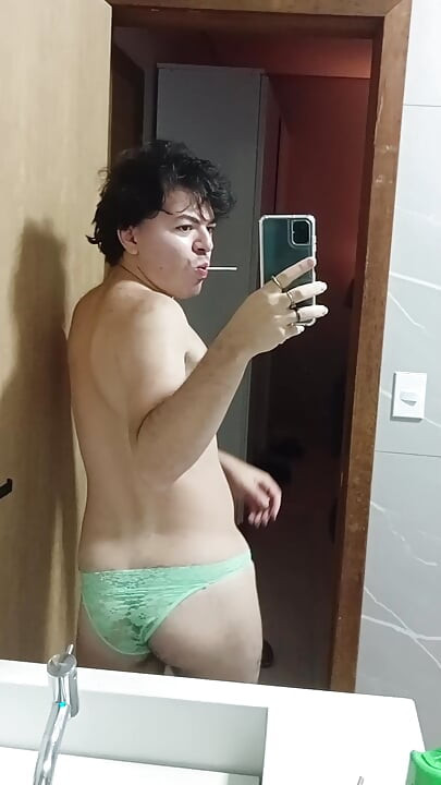 gay femboy sexy skirt lingerie and licking lollipop