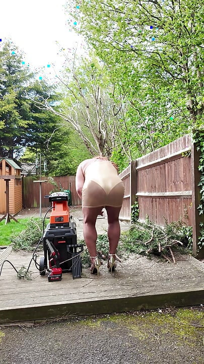 Sexy Crossdresser kellycd2022 in gold dress and heels out in the garden