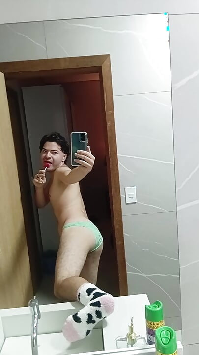 gay femboy sexy skirt lingerie and licking lollipop