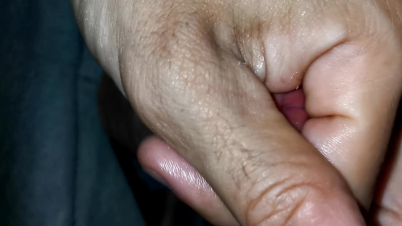 Playing with the head of a wet penis