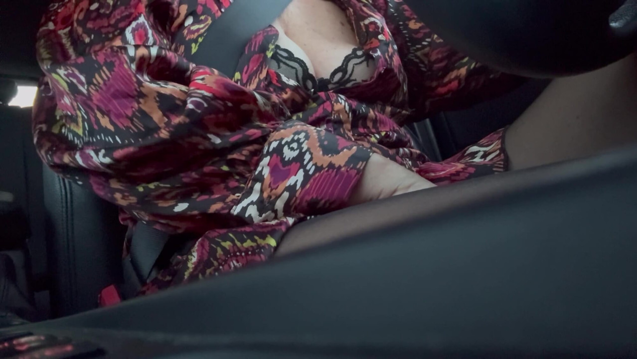 Horny sexy milf shows her boobs in the car on a public road