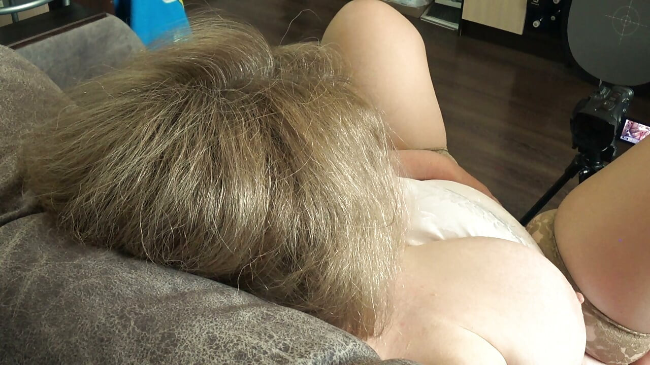 Big Tits From Above. a Camera Watches From the Side as a Plump MILF Masturbates and Records a Video.