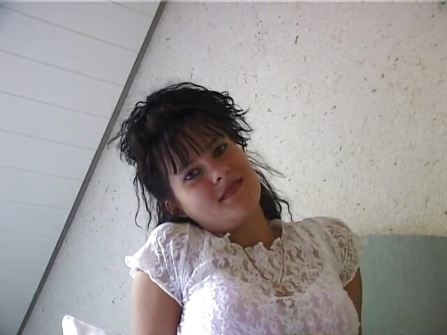 Horny girl lays in bed finger fucking herself and stroking clit
