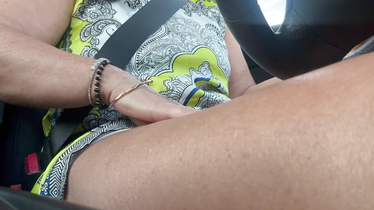 The beautiful and elegant stepmom Michelle drives to work in the morning.