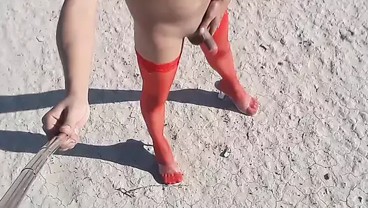 She strips naked in public with red pantyhose and heels