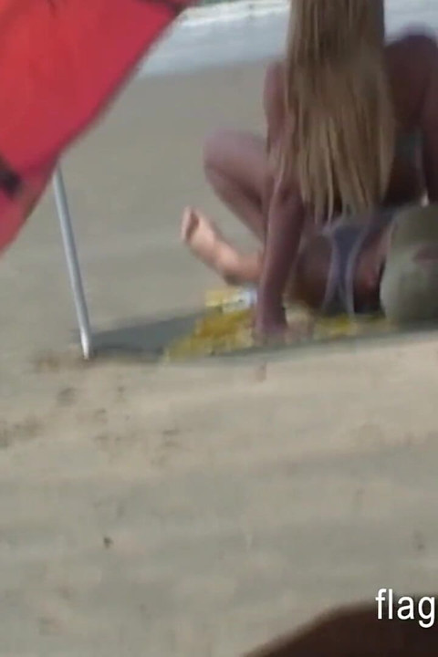 Brazilian couple having sex on the empty beach