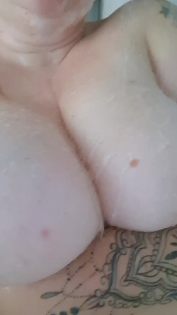 Woman with big tits under the shower