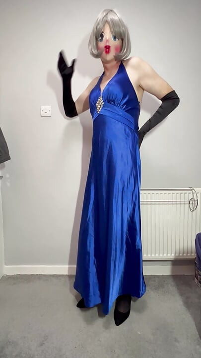 Sissy crossdresser playing in a satin ball gown