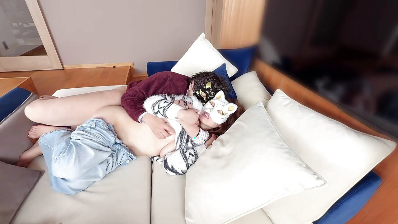 On the Sofa in Their Secret Room, They Shared Passionate Kisses Before Making Love, Expressing Their Deep Love.