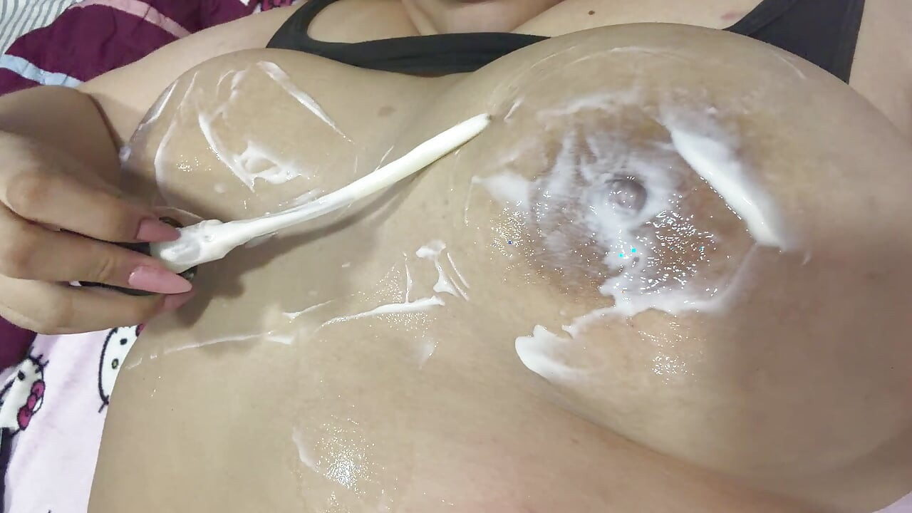 Mom massages her big tits with a very delicious cream