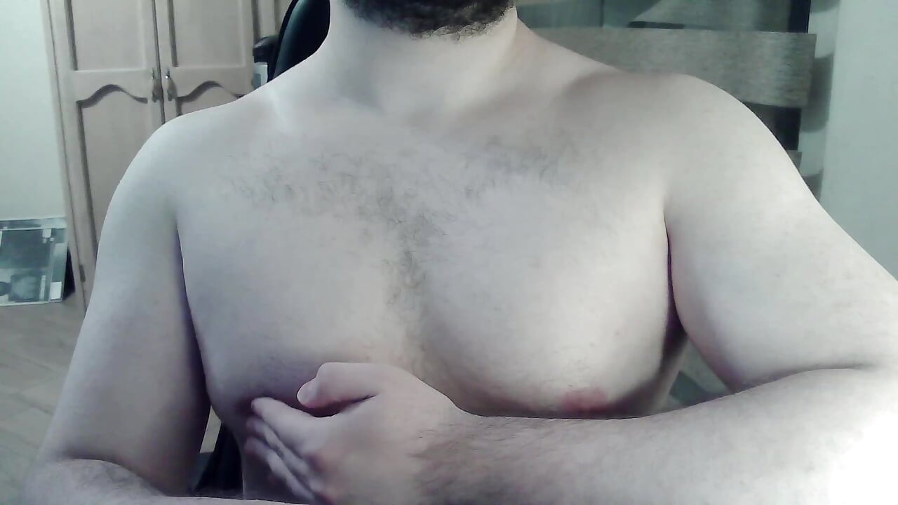 Hot beefy camboy shows off the goods during a show