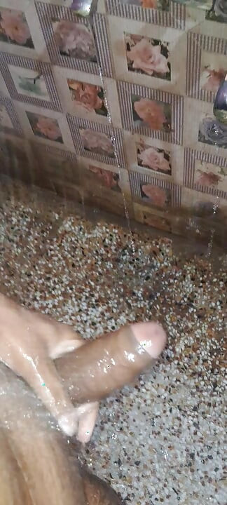 A Young Hindu Boy From India Is Fucking His Thick Cock Hard with His Hands While Taking a Bath