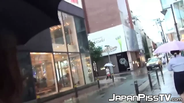 Young Japanese takes her panties off to pee in a coffee shop