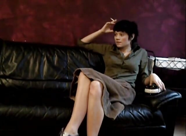 Black haired teen smoking a cigarette