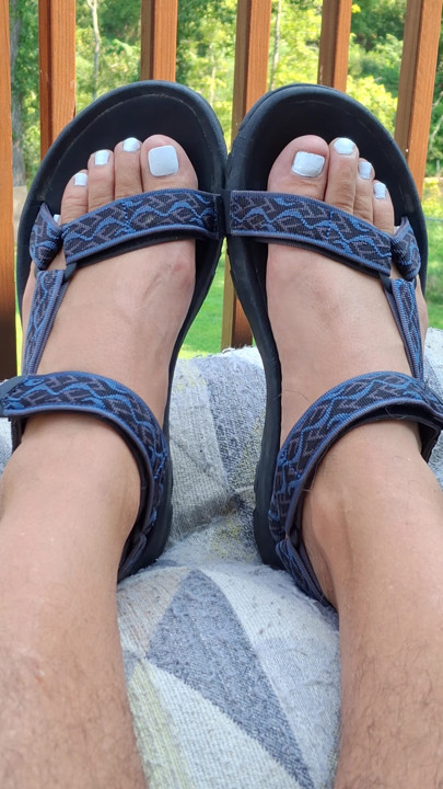 Showing off my painted white toes in strappy Teva sandals